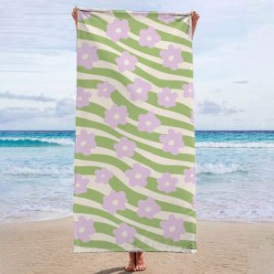 Purple flowers with green stripes Beach Towel